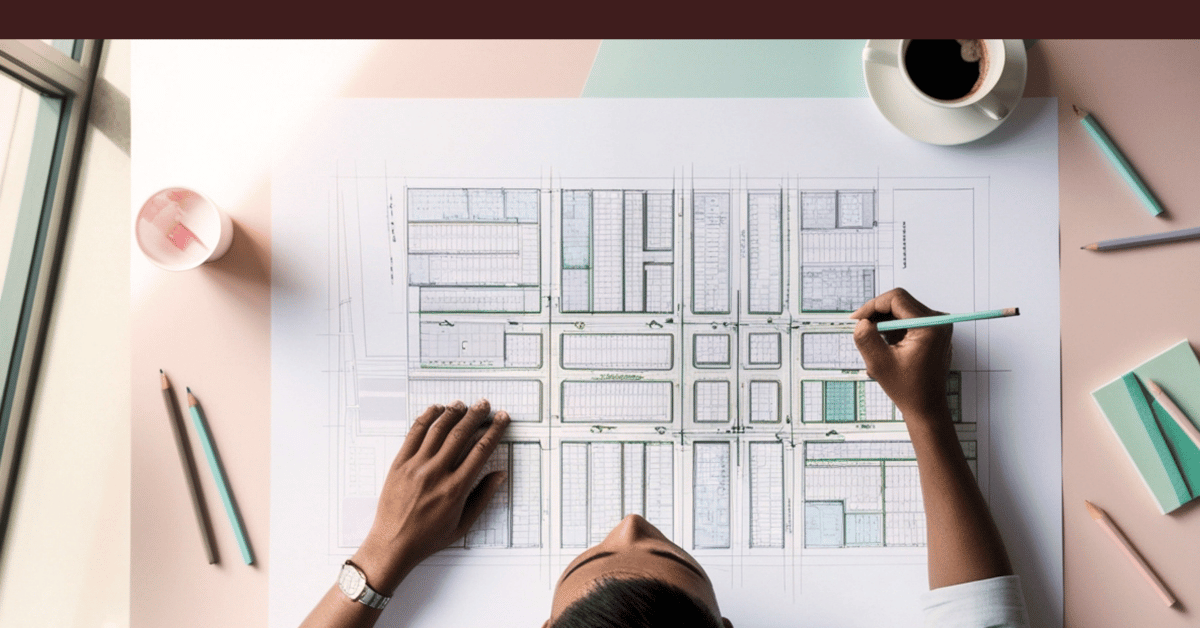 Overhead view of a woman drafting a detailed layout, symbolizing structured marketing leadership planning.