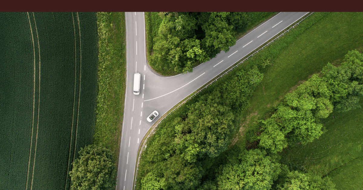 Aerial view of a Y-shaped road intersection representing a strategic business inflection point.